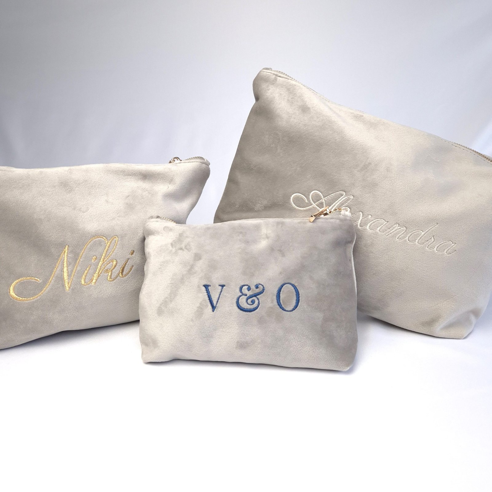 Ciel des Rêves Collection – Personalize Your Edoaria Bag with Grand Duo Monogram Three Edoaria bags from the Ciel des Rêves Collection in cream, gold, and topaz blue, showcasing the Grand Duo Monogram customization