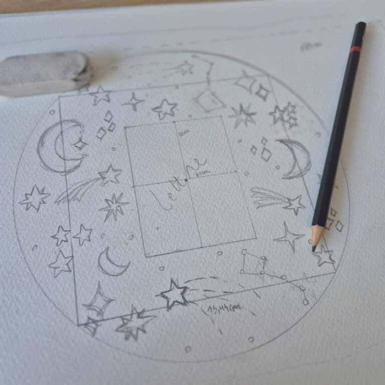 close-up of hand-drawn illustrations by Alexandra Emonts on a sketchpad.