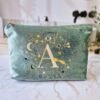 Aqua Marine Teal velvet pouch with gold, cream and blue moon, stars, and evil eye embroidery, part of the Ciel des Rêves collection by Edoaria, limited-edition prototype toiletry bag.