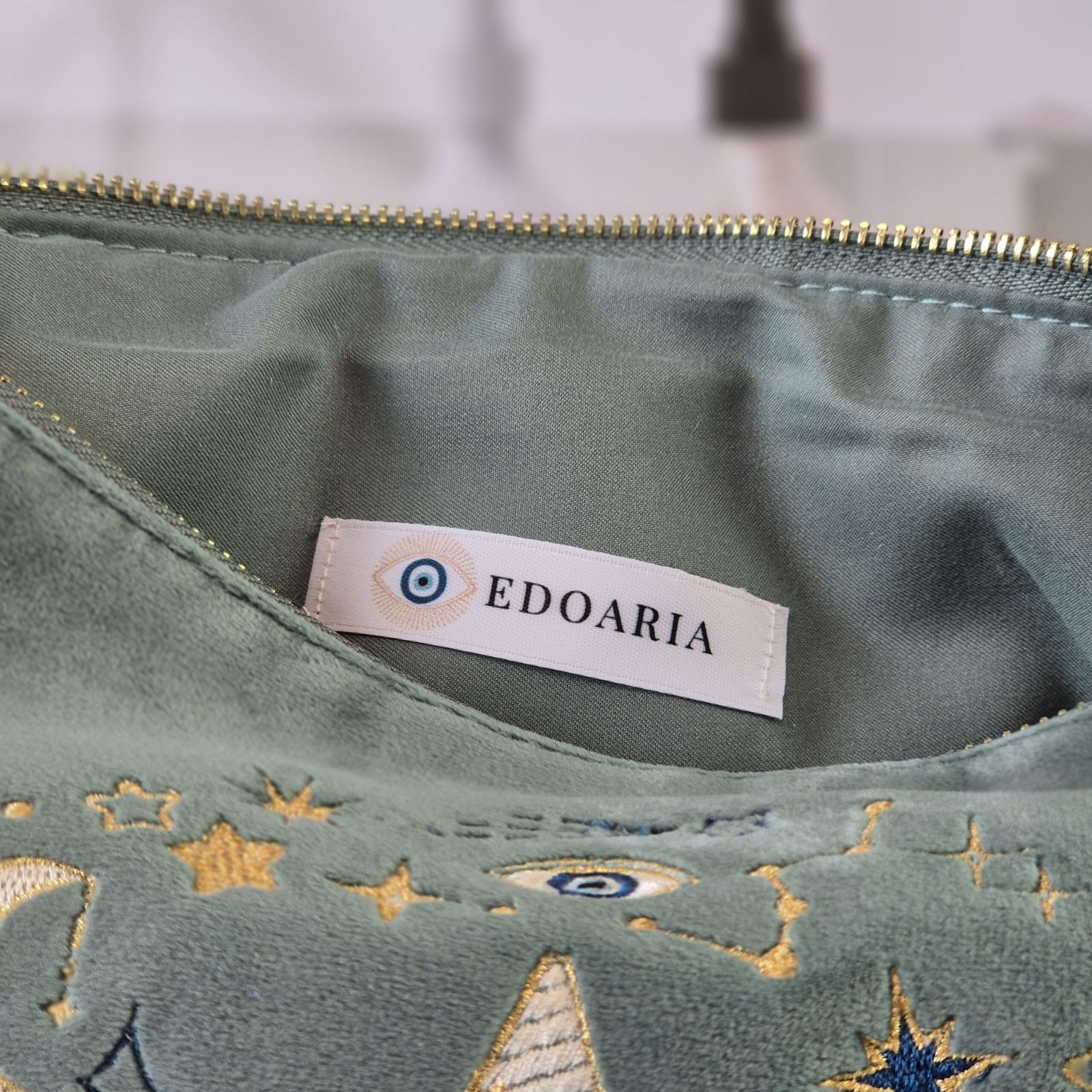 Aqua Marine velvet opened pouch with teal lining and Edoaria Label, part of the Ciel des Rêves collection by Edoaria, limited-edition prototype toiletry bag.