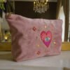 Alternative angled view of the Edoaria Rouge Amour Grand Toiletry Bag, showcasing detailed embroidery.