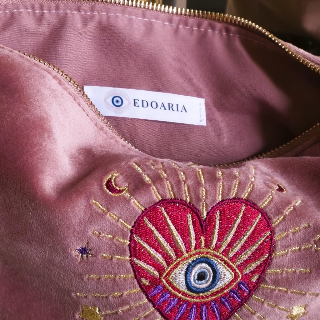 Interior of the Rouge Amour Signature Sleek Pouch, featuring a soft lining and Edoaria’s branding.