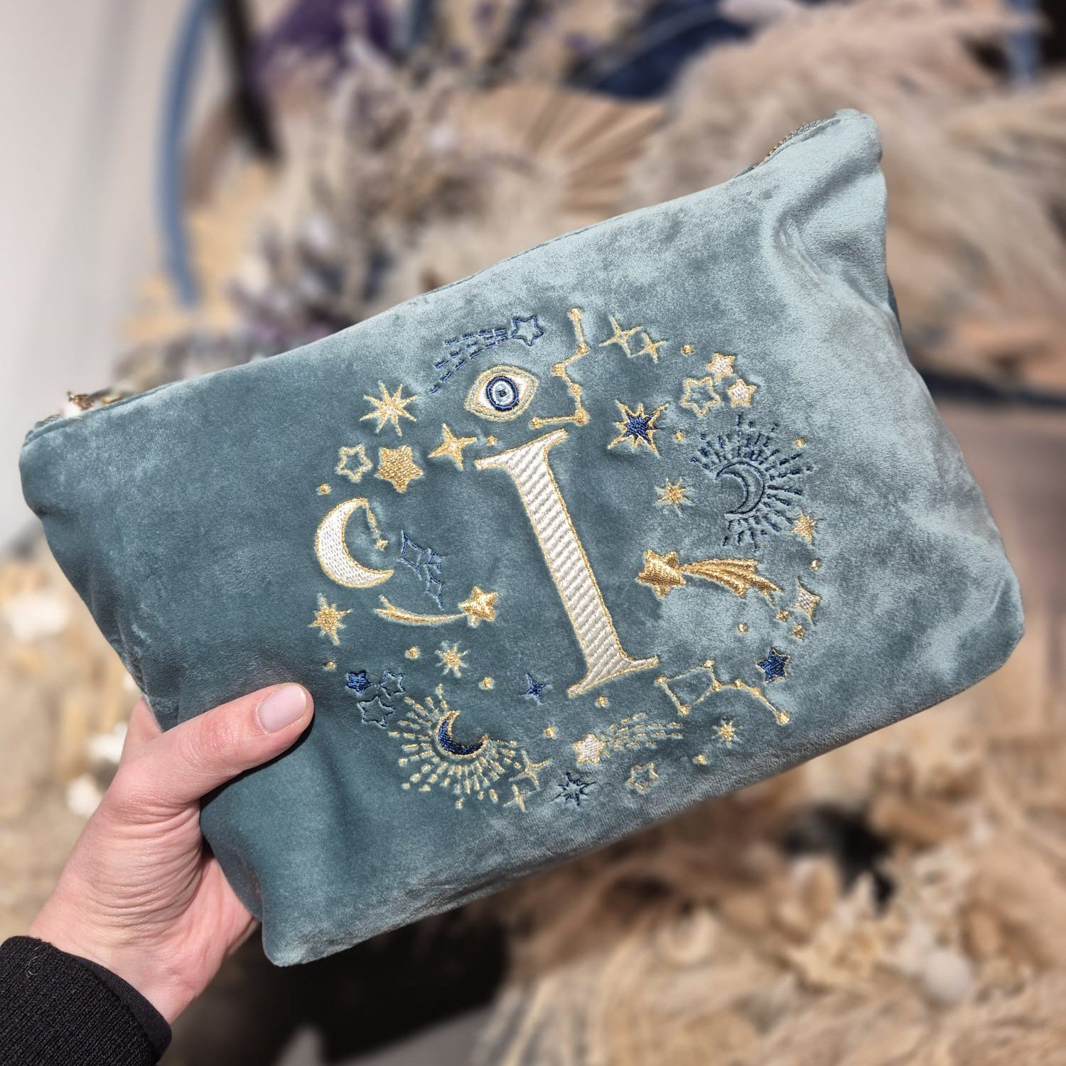 Aqua Marine Teal velvet pouch with gold, cream and blue moon, stars, and evil eye embroidery, part of the Ciel des Rêves collection by Edoaria, limited-edition prototype toiletry bag.
