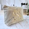 Side View: Beige Velvet Pouch "S" Letter Edition – Ciel des Rêves by Edoaria Side view of the Beige Moonstone velvet pouch with the letter "S" embroidered alongside gold and blue celestial details, Ciel des Rêves collection by Edoaria.