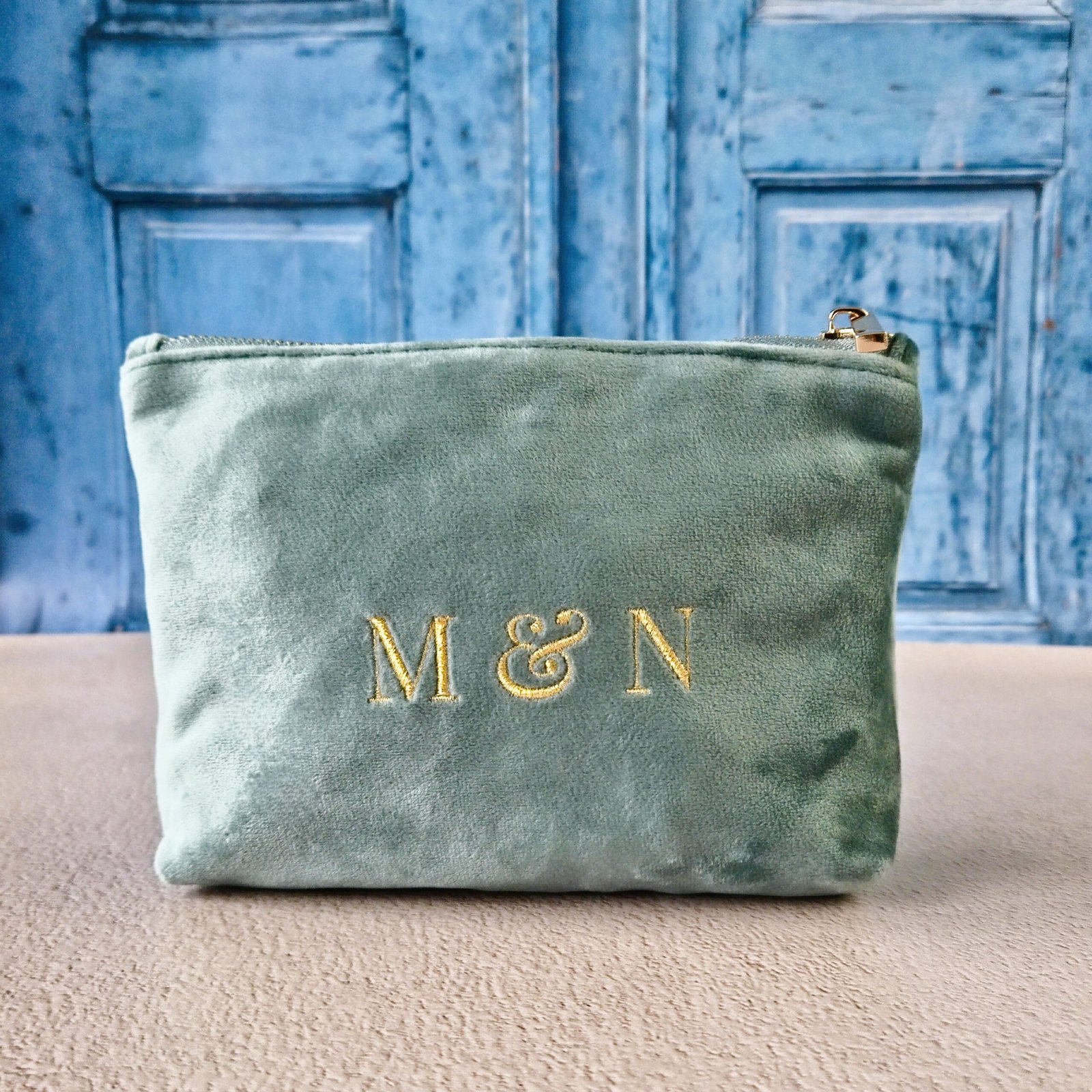 Petite makeup bags with Grand Duo monogram in aqua, personalized pouch