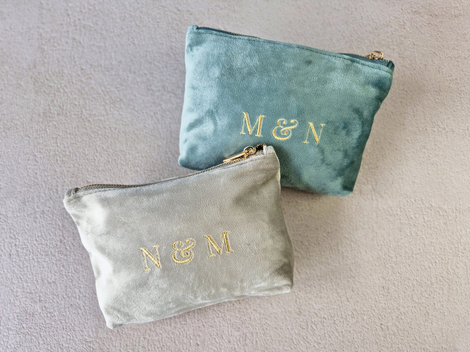 Petite makeup bags with Grand Duo monogram in aqua and moonstone, personalized pouch