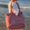 Alexandra, our owner, wearing the Edoaria Everyday tote bag from the Rouge Amour collection with embroidered logo