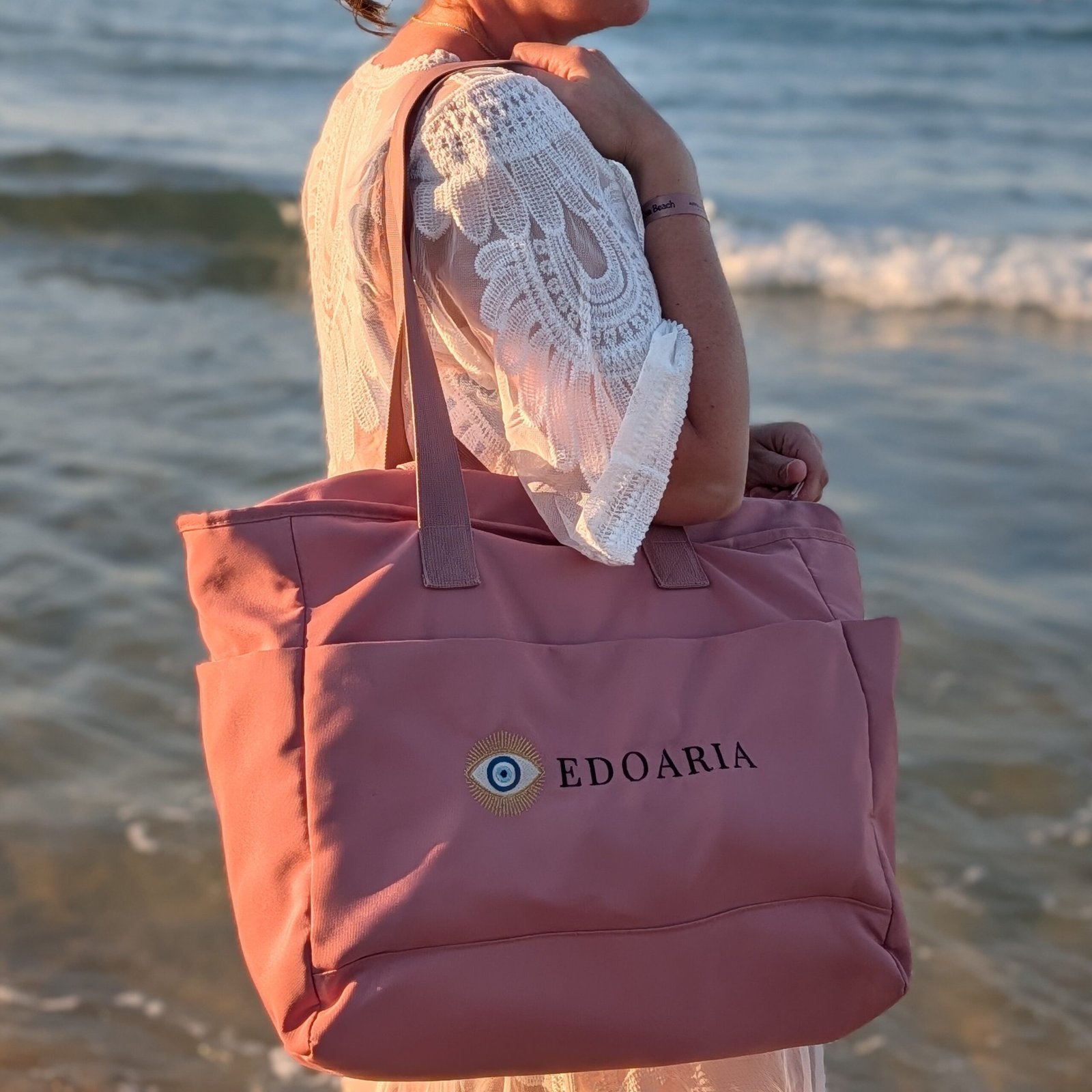 Alexandra, our owner, wearing the Edoaria Everyday tote bag from the Rouge Amour collection with embroidered logo