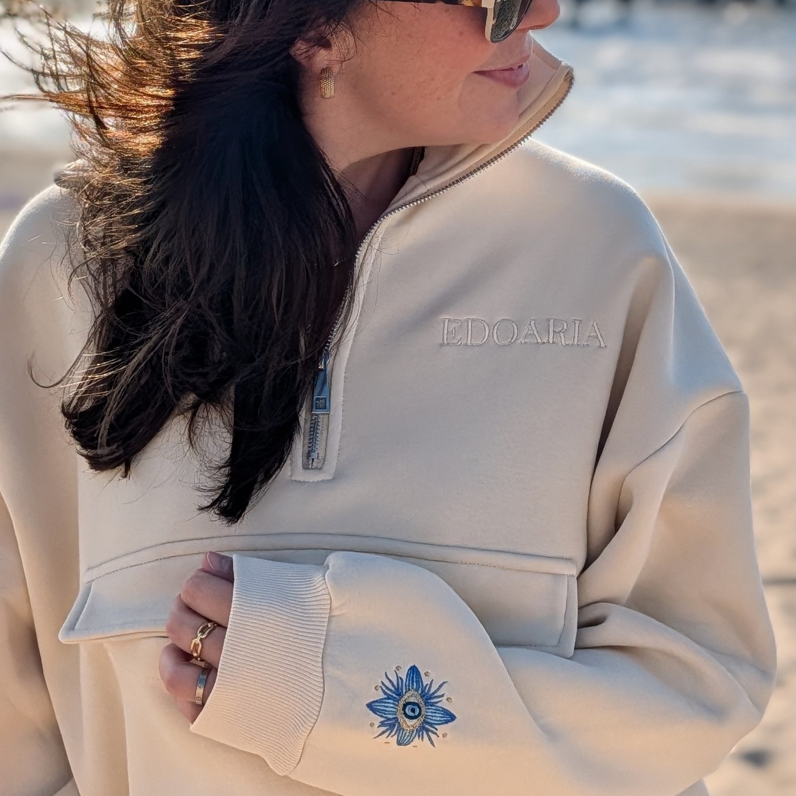Alexandra, our owner, wearing the Edoaria our mixed cotton embroidered sweatshirt with zipped polo neckline from the Jardin des cyclades collection.