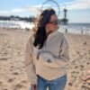 Alexandra, our owner, wearing the Edoaria our mixed cotton embroidered sweatshirt with zipped polo neckline from the Jardin des cyclades collection.
