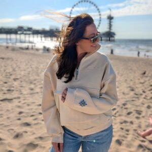 Alexandra, our owner, wearing the Edoaria our mixed cotton embroidered sweatshirt with zipped polo neckline from the Jardin des cyclades collection.