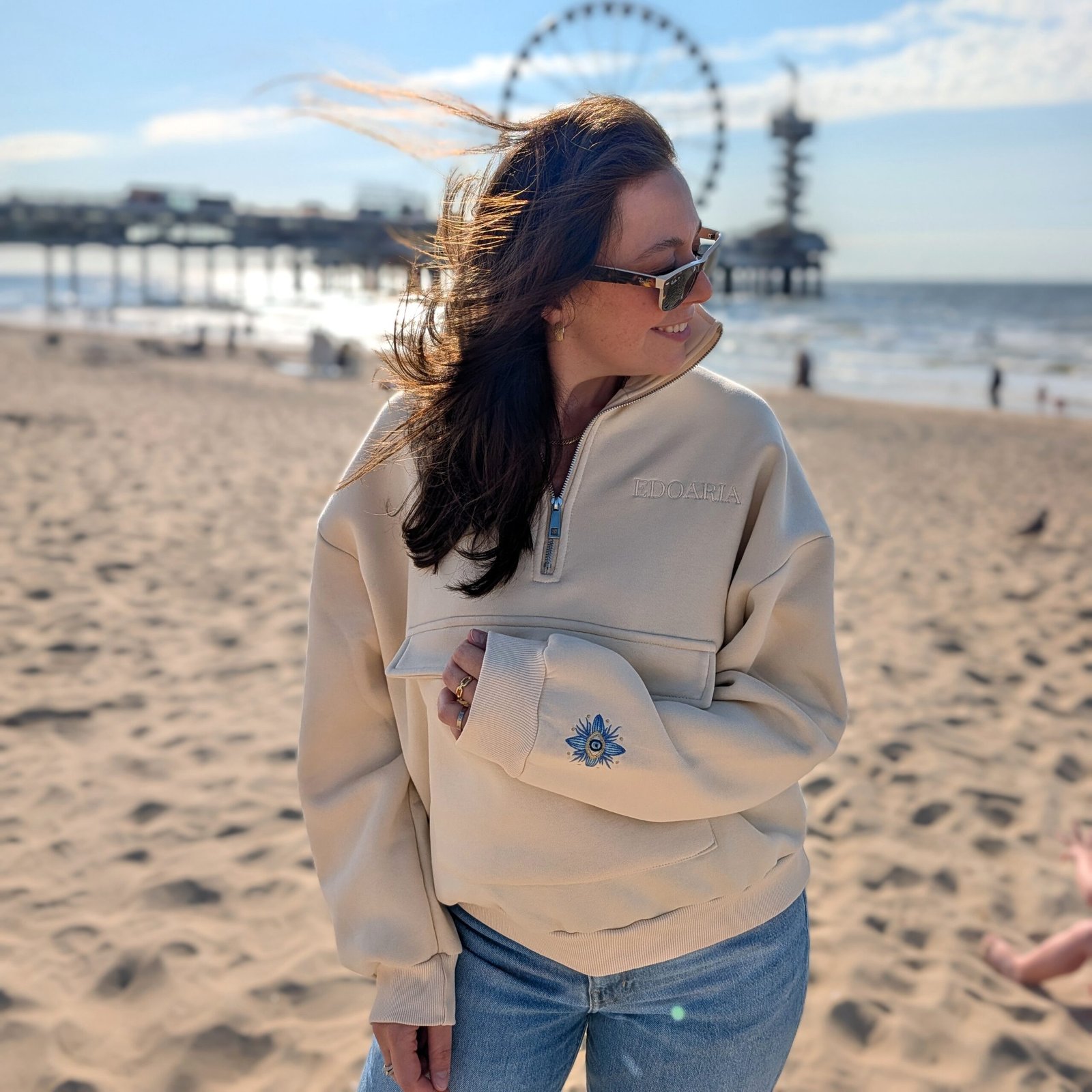Alexandra, our owner, wearing the Edoaria our mixed cotton embroidered sweatshirt with zipped polo neckline from the Jardin des cyclades collection.